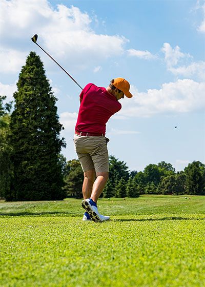 Golfer driving off the tee